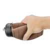 Hand holding rugby ball water bottle showing non-slip textured grip