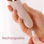 Rechargeable electric foot callus remover charging port shown in hand